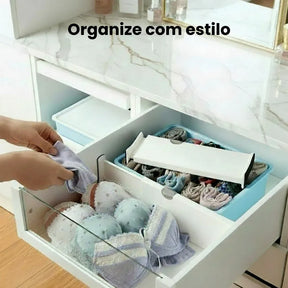 divisor expansivel de gavetas para roupas íntimas em cômoda branca com tampo de mármore elegante.